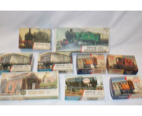 A selection of Airfix 00 gauge unmade boxed railway kits including Prairie tank, saddle tank, engine shed and 7 wagon kits