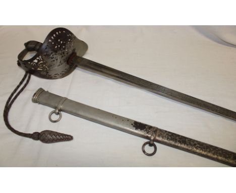 An Edward VII Infantry Officer's sword with etched steel blade, steel guard with wire bound fish skin grip in steel scabbard