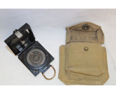 A Second War Mark I magnetic marching compass in webbing pouch dated 1942