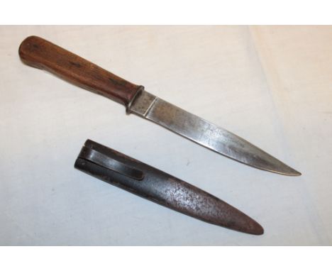 A First War German trench fighting knife with 6" single edged blade and wood grips in steel sheath