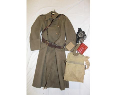 A Second War Captain's khaki greatcoat of the Royal Army Medical Corps with Sam Browne belt, Second War gas mask with bag and