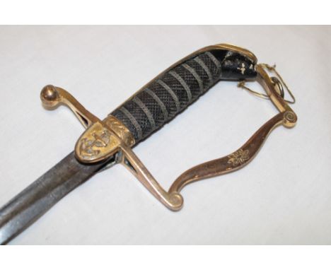 A George III Naval Officer's light dress sword with 24½" single edged blade, gilt brass stirrup hilt with wire bound checkere