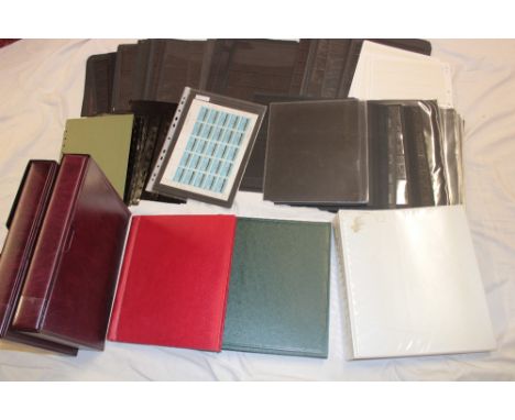 A box containing various Hagner leaves, ring binders, slip cases, empty albums etc.