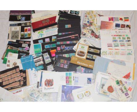 A large selection of GB first day covers, presentation packs, packets of stamps, booklets etc.