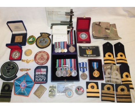 A group of medals, awards and insignia relating to Lt. T. J. Barker Royal Navy:- Operational Service medal with Sierra Leone 