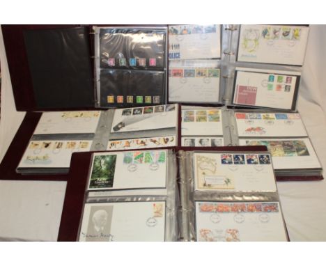 Five albums containing a large selection of GB first day covers and stamp presentation packs, 1980's-2000