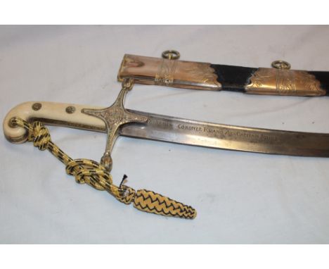 An early 19th century Mameluke-hilted Naval sword relating to the 1830's Spanish Carlist Wars and presented to an English Nav