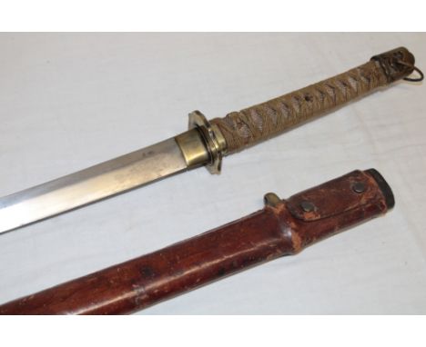 A Second War Japanese Military sword/katana with 26½" blade, unsigned tang, wire bound ray skin grip in brass military mounts