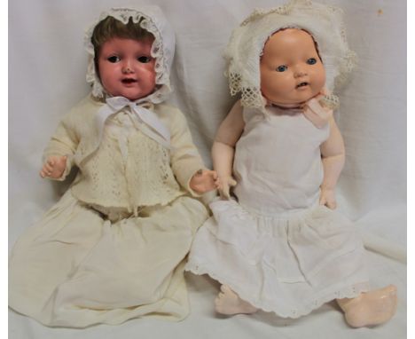A German doll by H. W. Germany with composition jointed body 17" long and one other composition doll by K. & R. Germany (2)