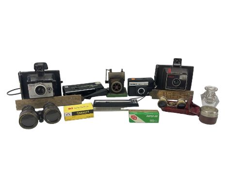 Two Polaroid cameras, opera glasses, field glasses etc