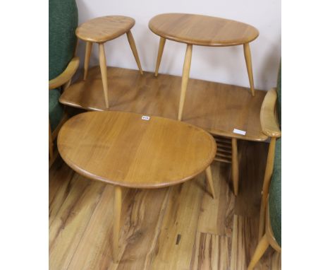 An Ercol nest of three light elm shaped topped coffee tables and one other coffee table, coffee table 103cm wide coffee table