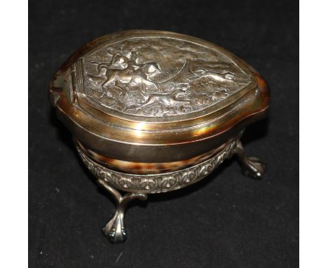 A 19th century cowrie shell table snuff box, with plated embossed hinged cover and stand