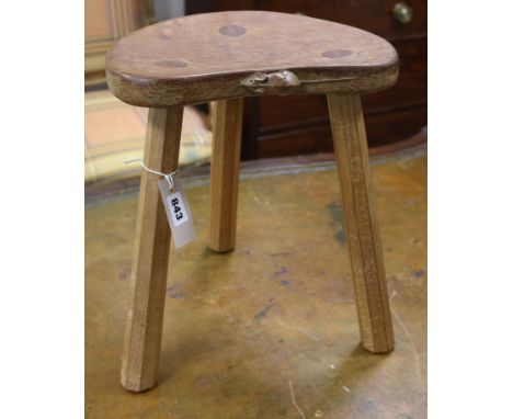 A Robert Thompson Mouseman stool, 35cm high