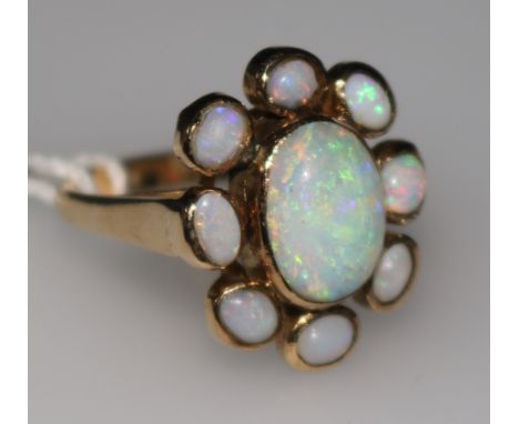 A 9ct gold & white opal cluster ring, set with nine cabochons, size M.