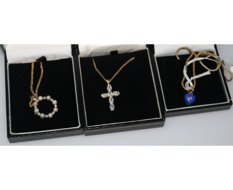 A late Victorian 9ct gold, enamel and split pearl set heart shaped pendant on a 9ct gold chain and two other pendant necklace