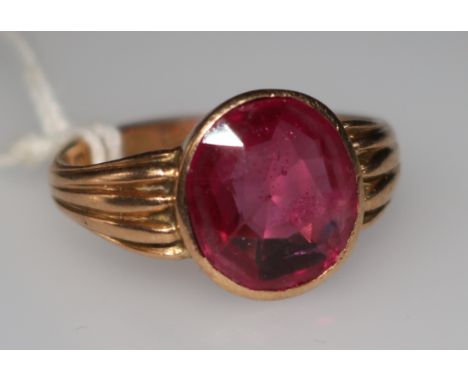 A 15ct gold and synthetic ruby ring, size R.