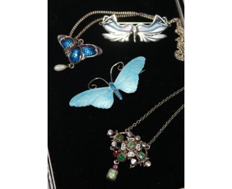 A 19th century continental gem set and enamel pendant necklace, a later silver & enamel pendant and two brooches.