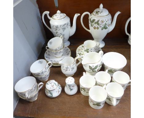 A Wedgwood Strawberry Hill six setting coffee set and a Grosvenor Crestwood six setting coffee set, lacking two saucers