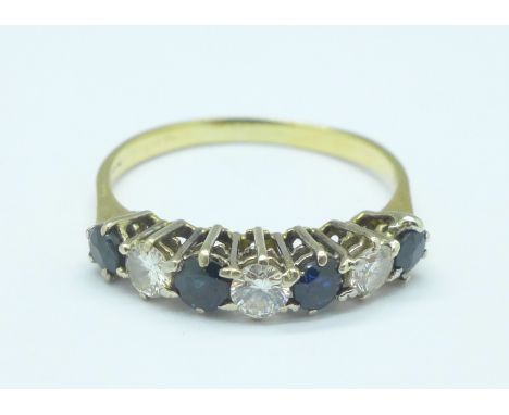 An 18ct gold, sapphire and diamond seven stone ring, 2.7g, S