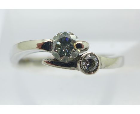 A platinum, two stone diamond ring, 0.25ct diamond weight, Birmingham 2004, 3.6g, K½