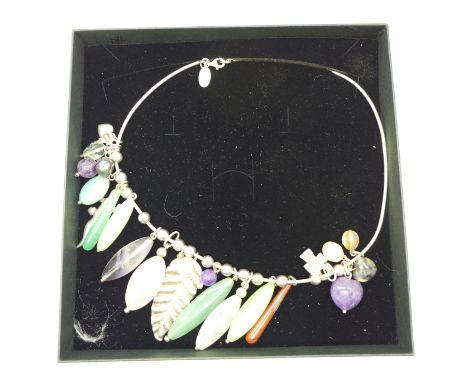 A Strata silver necklace set with gemstones, amethyst, jade and silver charms
