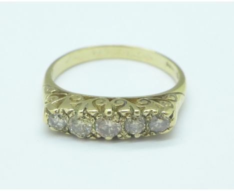 A 9ct gold and five stone diamond ring, approximately 0.70 carat, 3.3g, R