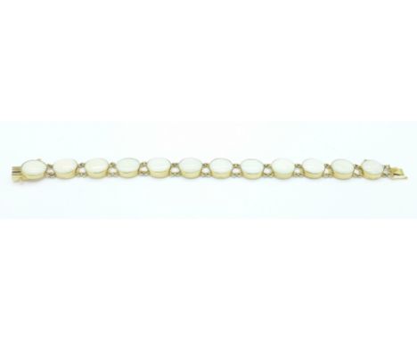 A 9ct gold and opal bracelet, set with twelve 11mm x 9mm opals, two stones a/f