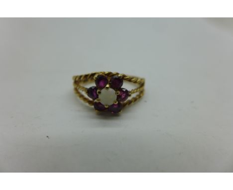 A 9ct gold, red stone and opal ring, 1.8g, J