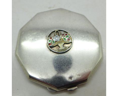 An enamelled silver compact