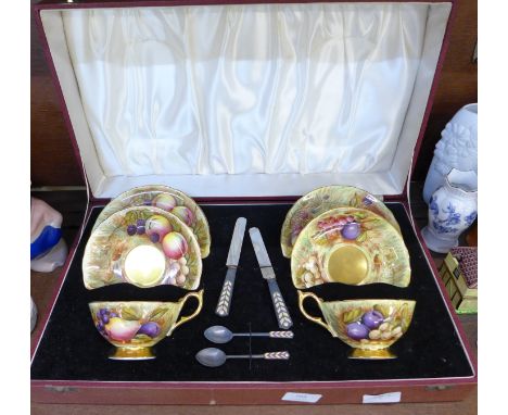 An Aynsley tea for two tea set, cased, signed D. Jones, with hallmarked silver and enamel spoons and knife handles