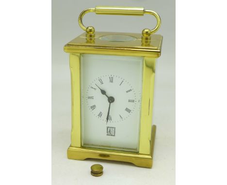 A small carriage clock, the movement marked Fema, London, no key, (back panel button loose)