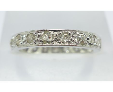 A twenty stone diamond full eternity ring, minimum diamond content 1ct, 4.9g, O, tests as platinum