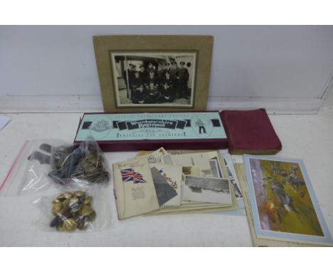 Military items including uniform buttons, photographs, dog tags, a Britains Worcestershire Regiment, boxed, three propaganda 