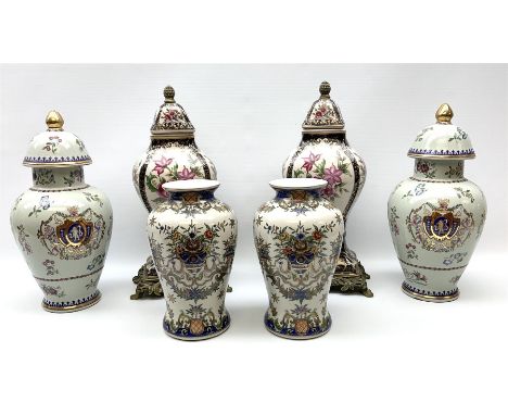 Pair ceramic urns and covers with gilded finials, decorated with cherubs and floral imagery, a pair of cream vases with blue 
