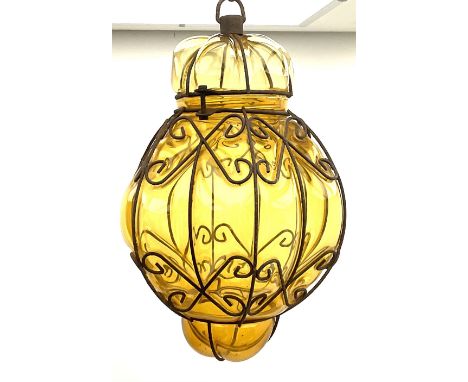 Continental ceiling light amber glass encased in an iron frame 38cm. 