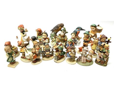 Collection of sixteen Hummel figures including 'Heavenly Angel', girl with watering can, girl on fence etc, along with other 