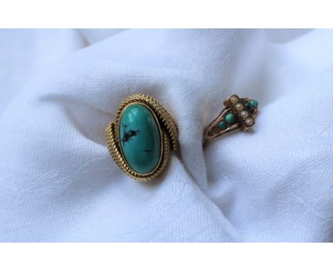 An 18ct yellow gold and turquoise set ring, the oval turquoise approximately 18 x 10mm with wire decoration together with a t