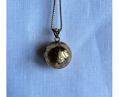 A 9ct yellow gold globe shaped hinged locket on a 9ct gold box link necklace, approximately 14 grams