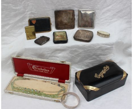 A George V silver gilt and ebony cigarette box, Sheffield, 1911, Walker and Hall together with silver cigarette cases, a silv