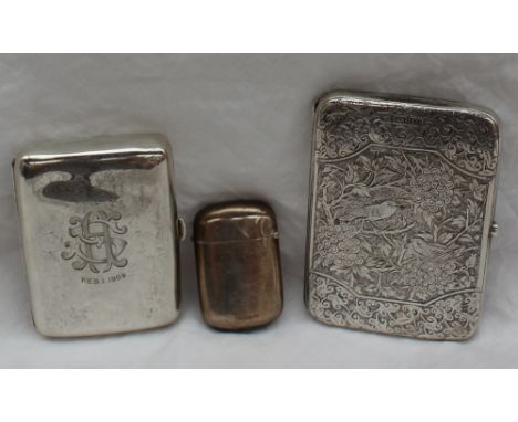 A late Victorian silver note case, of rectangular form with rounded corners, engraved with flowers and leaves, the interior w