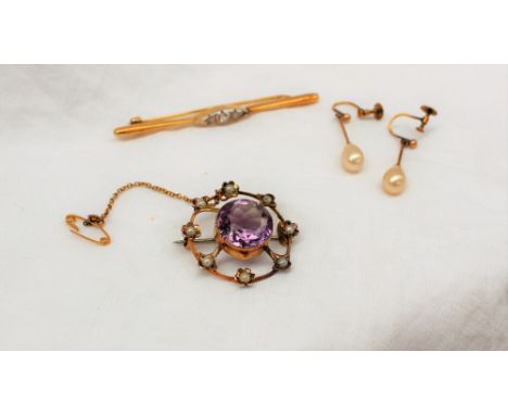 An amethyst and pearl brooch, the central amethyst surrounded by eight seed pearls to a yellow metal setting together with a 