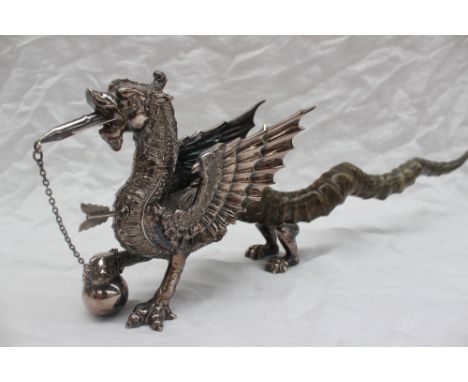 A Welsh Dragon table lighter the silver plated body of the dragon finely formed with wick in mouth, a lighter in chest formed