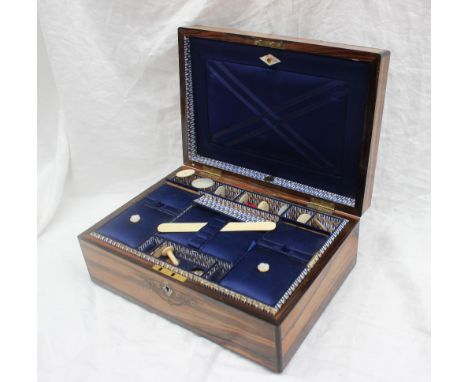 A Victorian coromandel sewing box of rectangular form, the top inlaid with brass and mother of pearl, the interior with lidde
