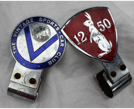 An Alvis 12/50 enamel car badge by Desmo, of shield shape with a Hare to a red enamel ground together with a Vintage Sports C