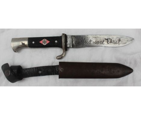 A Third Reich Hitler Youth dagger with enamelled insignia to chequered grip, the blade with stylised inscription 'Blut Und Eh