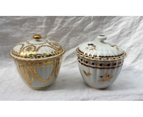 An 18th century Worcester sucrier and cover, the circular cover with blue and gilt flowers, the ribbed tapering body with flo
