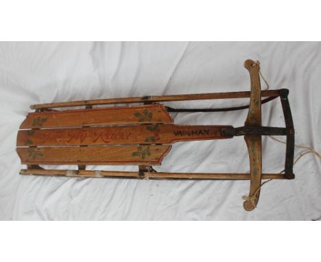 An American "Firefly Racer" Series D sled, with a metal underframe and steering, decorated with holly and ivy, 125cm long x 5