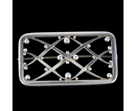 GEORG JENSEN & WENDEL - an Art Deco Danish sterling silver lattice and ball brooch, designed by Harald Nielsen circa 1939, mo