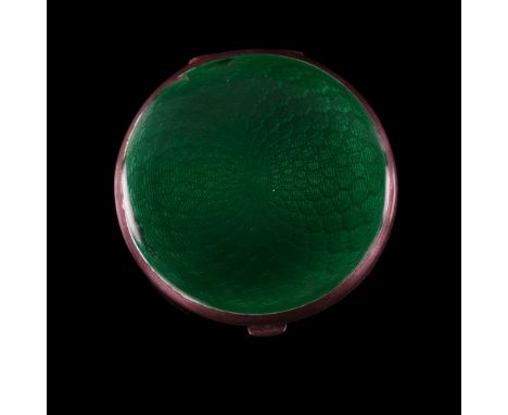 An Art Deco George V silver and green enamel compact, circular form with engine turned decoration and gilt interior, by Crisf