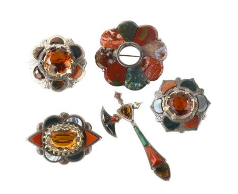 A group of Scottish hardstone brooches, including axe example, unmarked silver settings, axe length 76.7mm, 82.9g total (5)1 